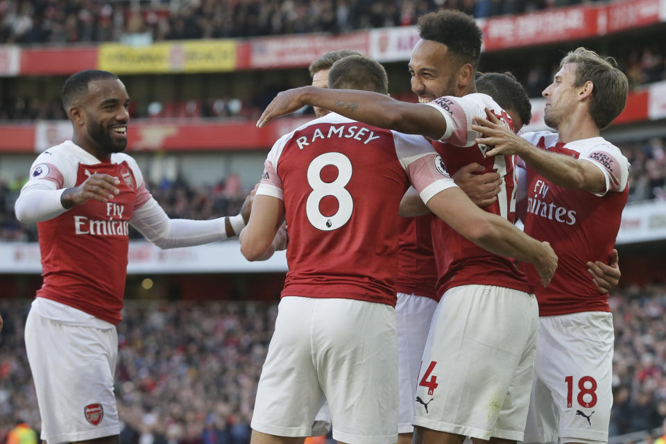 Arsenal's Pierre-Emerick Aubameyang, centre right, celebrates with team mates after scoring his side's 2nd goal during an English Premier League soccer match between Arsenal and Everton at the Emirates Stadium in London, Sunday Sept. 23, 2018. (AP Photo/Tim Ireland)