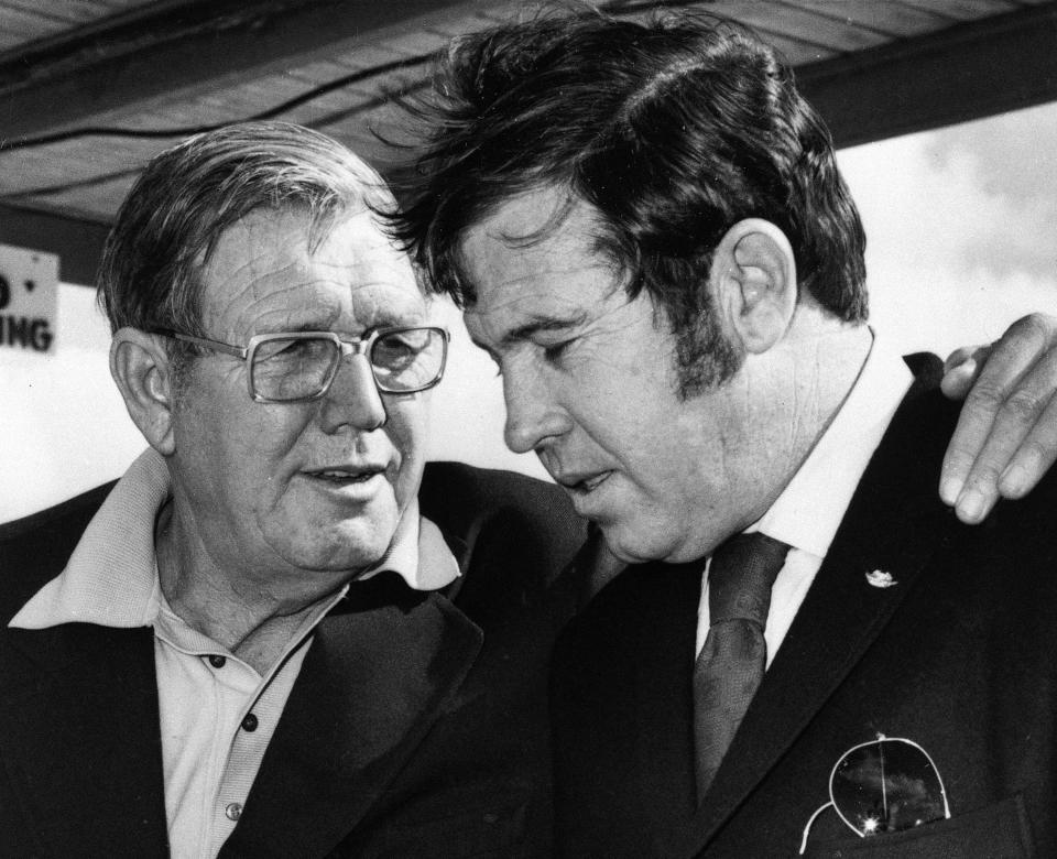 FILE - Bill France Sr., left, and son Bill France Jr. talk in Daytona Beach, Fla., Jan. 11, 1972. Bill Sr. was a racing enthusiast who saw Daytona Beach as a fit for his family, and when he grew tired of disorganization of the local racing scene, he called a meeting to put together a formal league. It was called NASCAR and what started as a small regional hobby has grown over 75 years into the most popular form of racing in the United States. (AP Photo/File)