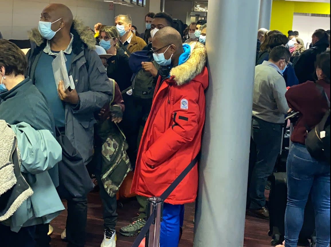 Waiting game: Passengers booked on Air France flight 406 queuing at Paris Charles de Gaulle airport (Carla Castagnola)