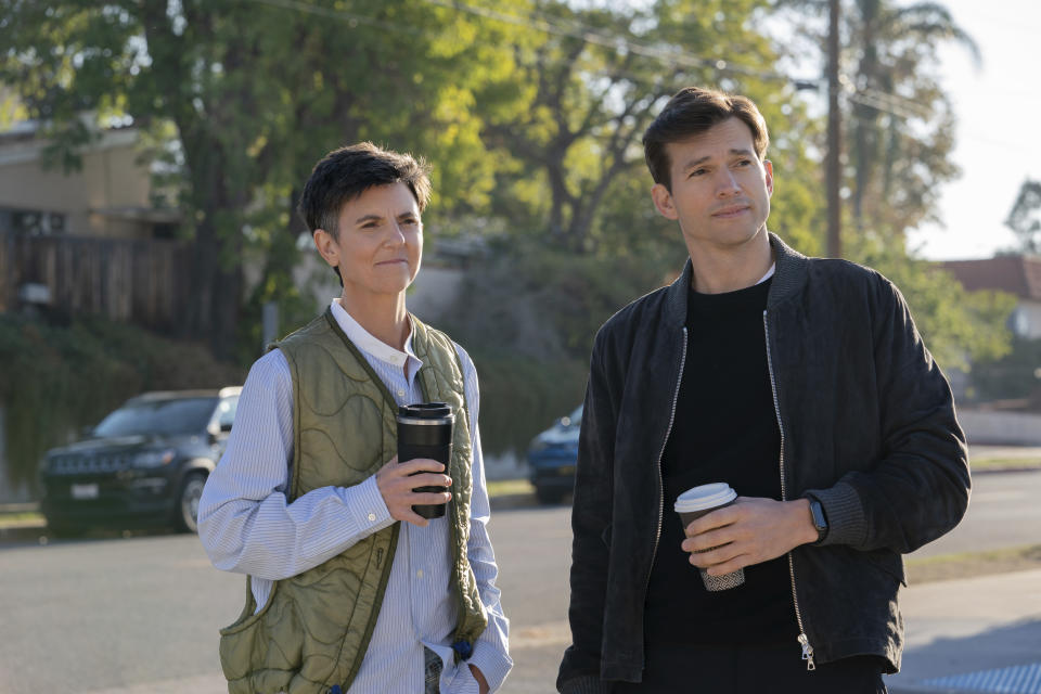 This image released by Netflix shows Tig Notaro, left, and Ashton Kutcher in a scene from "Your Place or Mine." (Erin Simkin/Netflix via AP)