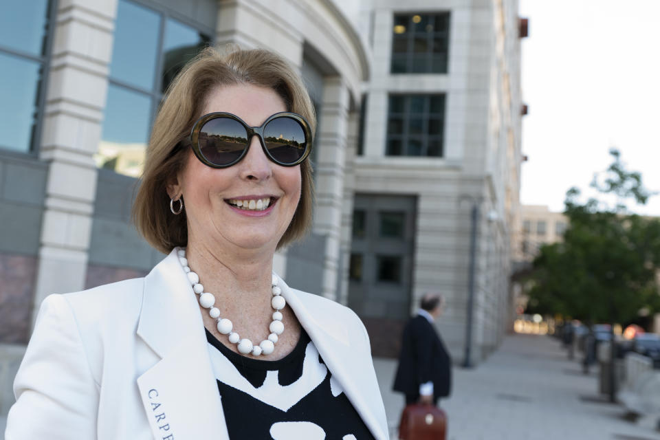 FILE - Sidney Powell, an attorney for former President Donald Trump, leaves the federal court in Washington, June 24, 2021. Fulton County District Attorney Fani Willis is seeking to have Powell, who tried persistently to overturn Trump's loss, testify before a special grand jury seated for the investigation of election interference. (AP Photo/Manuel Balce Ceneta, File)