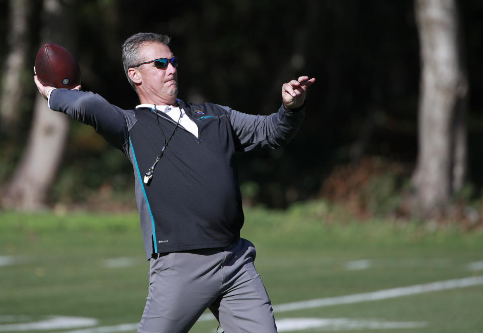 Jacksonville Jaguars head coach Urban Meyer throws the ball during a practice and media availability by the Jacksonville Jaguars at Chandlers Cross, England, Friday, Oct. 15, 2021. The Jaguars will plat the Miami Dolphins in London on Sunday. (AP Photo/Ian Walton)