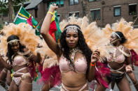 <p>The grand finale of the Notting Hill Carnival, during which performers present their costumes and dance to the rhythms of the mobile sound systems or steel bands along the streets of West London. (Photo: Wiktor Szymanowicz / Barcroft Media via Getty Images) </p>