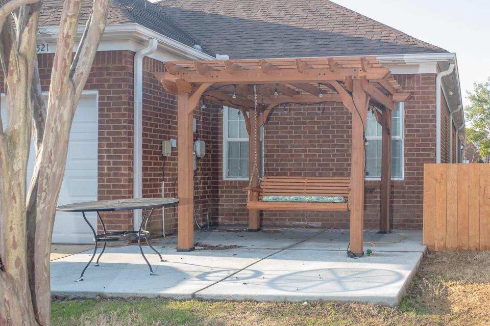 The recently poured patio with a pergola was one of the family’s projects.