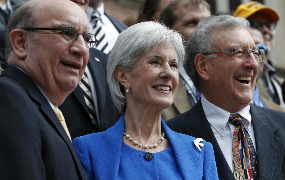 Health and Human Services Secretary Kathleen Sebelius, center, stands with CU-Boulder Chancellor Phil DiStefano, left, and Jim Palmer, longtime director of the University of Colorado's Conference on World Affairs, at the opening of the annual conference, in Boulder, Colo., on Monday, April 7, 2014. Sebelius opened the event as keynote speaker. (AP Photo/Brennan Linsley)