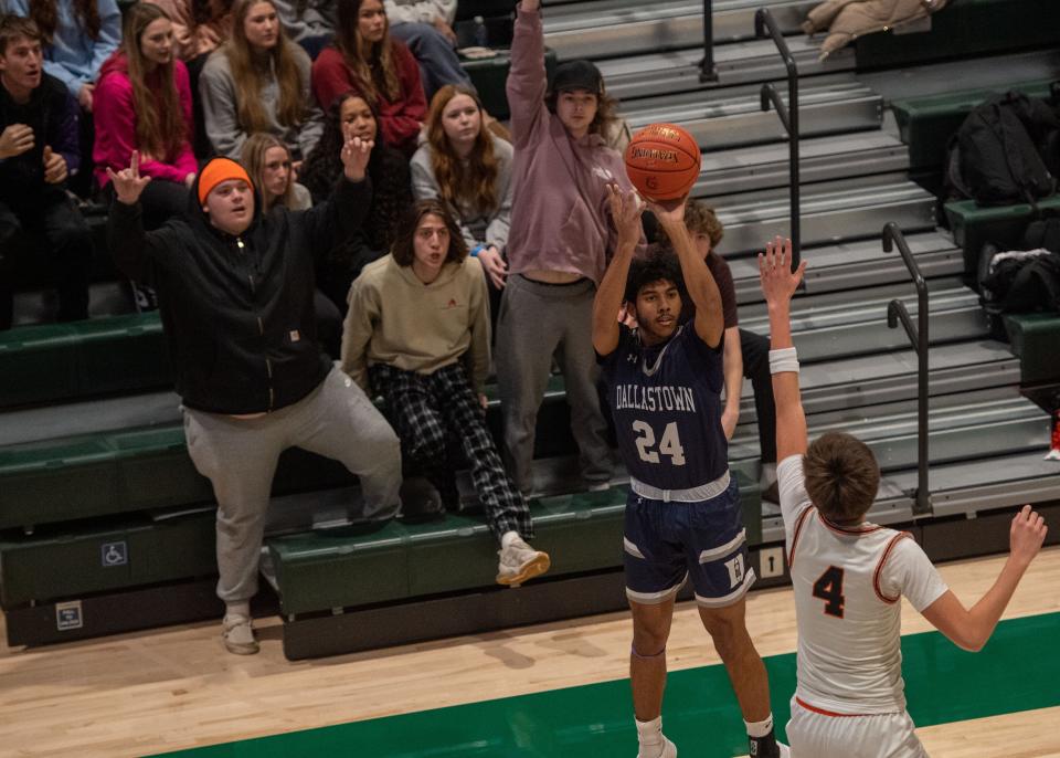 Dallastown’s student section watches as Kobe McNealy (24) shoots a 3-pointer over the defense by York Suburban’s Kai Stryhn (4) in Hoops for Harmony at York County Tech on Saturday, Jan. 13, 2024. Dallastown won 60-52.