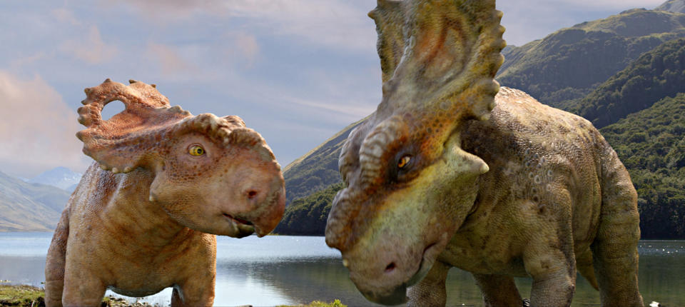 In this image released by 20th Century Fox, a Pachyrhinosaurus named Patchi, left, appears with his older brother Scowler in a scene from the film, "Walking With Dinosaurs." (AP Photo/20th Century Fox)