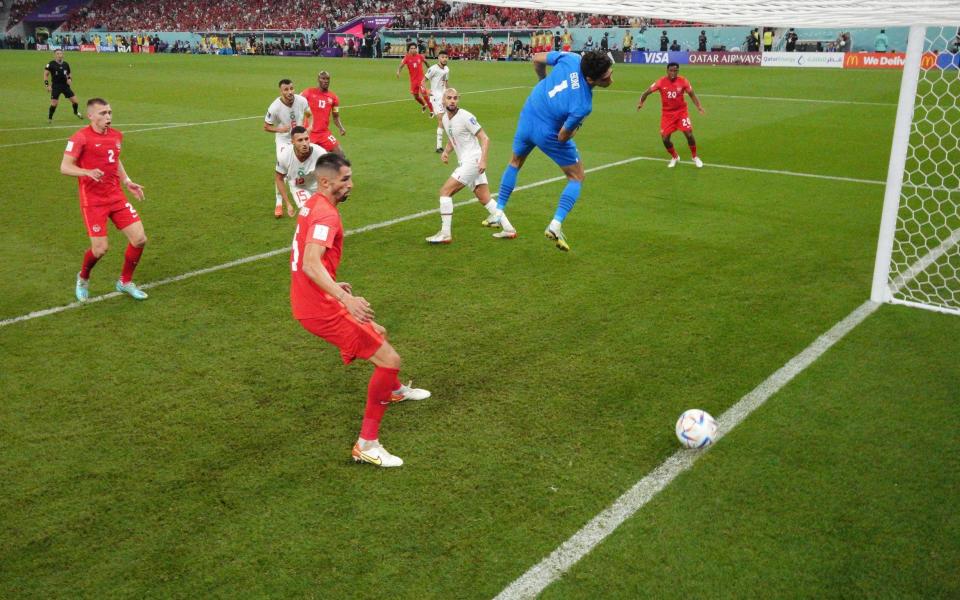 The header of Atiba Hutchinson of Canada drops on the goal line after hitting the crossbar during the FIFA World Cup Qatar 2022 Group F match between Canada and Morocco at Al Thumama Stadium - Matthias Hangst/Getty Images