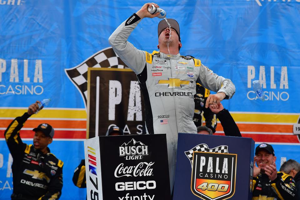 Kyle Busch celebrates after winning the Pala Casino 400 at Auto Club Speedway in Fontana, California.