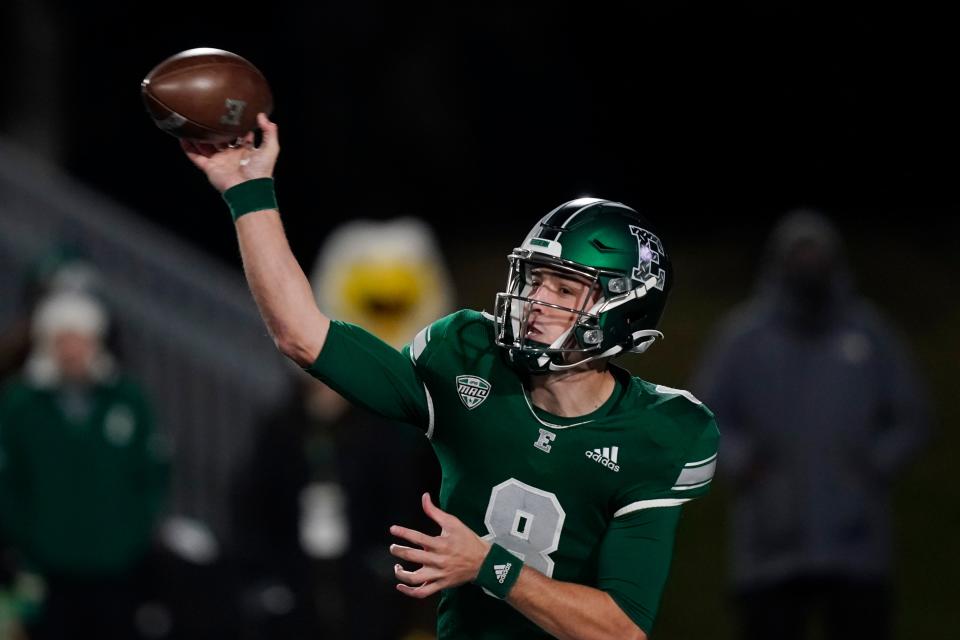 Eastern Michigan quarterback Ben Bryant throws during the first half of an NCAA college football game against Western Michigan, Tuesday, Nov. 16, 2021, in Ypsilanti, Mich.