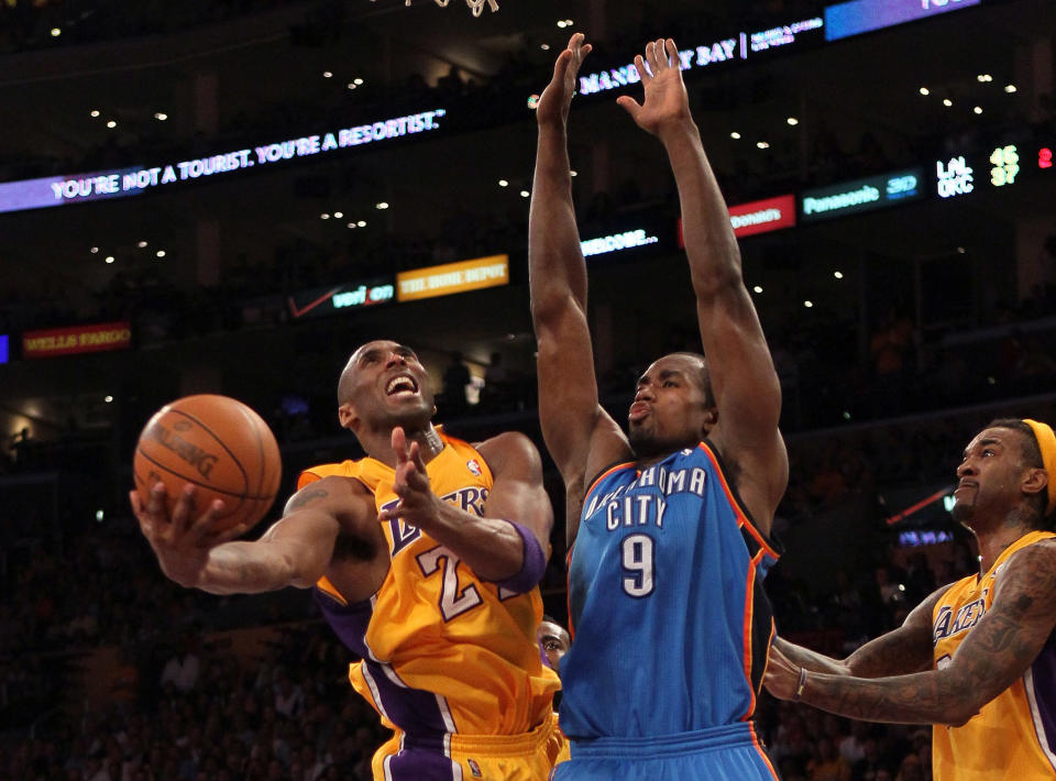 Lakers guard Kobe Bryant puts up a shot under the outstretched arms of Thunder forward Serge Ibaka on May 19 in Los Angeles. (Photo by Stephen Dunn/Getty Images)