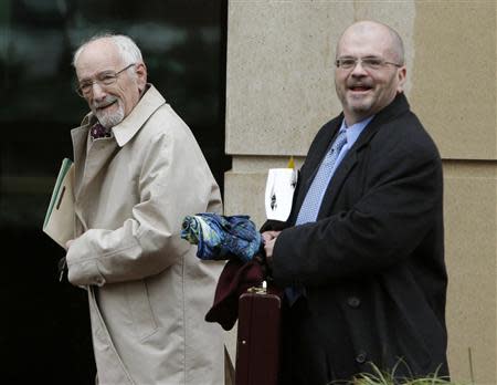 Attorney Thomas Wayne Biggs (R), who represented Martha Fuqua, departs the U.S. District Court in Alexandria, Virginia January 10, 2014. REUTERS/Gary Cameron