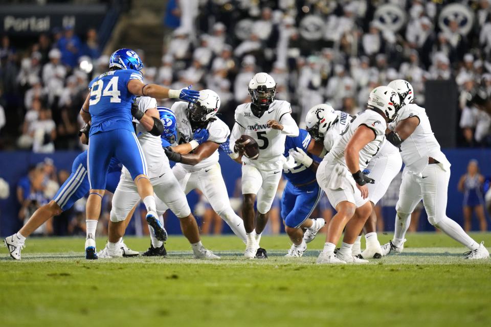 Cincinnati Bearcats quarterback Emory Jones (5) carries the ball in the second quarter during a college football game between the Brigham Young Cougars and the Cincinnati Bearcats, Friday, Sept. 29, 2023, at LaVell Edwards Stadium in Provo, Utah.