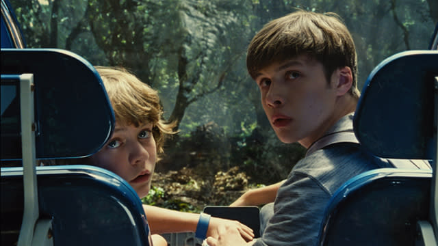 Is <em>Jurassic World</em> better than <em>Jurassic Park</em>? That seems to be the only question people want answered about director <strong>Colin Trevorrow</strong>’s ( <em>Safety Not Guaranteed</em>) reboot of the beloved franchise. Over a decade after the last installment — and 22 years after a T. rex wreacked havoc on the original park — Trevorrow's movie takes us back to Isla Nublar and a now fully functioning dinosaur theme park. To answer the question: It’s better than <em>The Lost World</em> and <em>Jurassic Park 3</em>, hands down, but nothing could top the original. Did you truly think it would? <strong> NEWS: This is what the cast of ‘Jurassic Park’ looks like over 20 years later</strong> Universal Pictures Up top, if you’re someone who thinks that <em>Jurassic Park</em> is too sacred for yet another sequel, you’re using extinct logic. When a property makes billions of box office dollars and is globally adored, studios will want to continue that success. 2013’s retrofitting of <em>JP</em> into 3D (a fad that’s since gone out of style as theaters look toward the fourth dimension) proved that it still has legs. Like bringing dinosaurs back to life using DNA found in blood from mosquitoes that were themselves found in petrified amber, you can only hope for the best. <em>Jurassic World</em> is the first entry worthy of being a <em>Jurassic Park</em> sequel. Smartly, <em>Jurassic World</em> leans heavily into the plot of <em>Jurassic Park</em>. (Whereas, if it leaned into the plot of <em>Lost World</em> — dinosaurs living in the wild on another, previously unheard of island! — or <em>JP3</em> — ??? — it would've caved in on itself.) Universal Pictures There’s a lot that will seem familiar: Odd couple protagonists ( <strong>Sam Neill</strong> and <strong>Laura Dern</strong> before; now, <strong>Chris Pratt</strong> as former-Navy animal whisperer Owen Grady and <strong>Bryce Dallas Howard</strong> as no-nonsense corporate darling Claire Dearing, who don’t start off as a couple, but, if you’ve ever seen a movie in your life, you know how they'll end up), and the children ( <strong>Nick Robinson</strong> and <strong>Ty Simpkins</strong>, both charming in a way kids in movies usually aren’t) who force the adults to put aside their differences for the greater good. There’s also the well-intentioned businessman who wants to spare no expense (John Hammond has relinquished the park to <strong>Irrfan Khan</strong>’s Mr. Masrani), the villain who wants to use dinosaurs for his own gain (Dennis Nedry succeeded by <strong>Vincent D'Onofrio</strong>’s InGen head of security, Vic Hoskins, who wants to militarize raptors), and a scientist who maybe oversteps his bounds ( <strong>BD Wong</strong> reprising his role, the only human character to return to the franchise). <strong> NEWS: Pratt tells ET what he’s sorry for on the ‘Jurassic World’ press tour</strong> Then there’s what’s new. That’s the movie's biggest triumph: The park itself. The grand, sweeping shots of Jurassic World, set to that classic <strong>John Williams</strong> theme, are the first time in three sequels that will make you feel any of the awe and magic you felt the first time. The attractions — including a petting zoo with baby triceratops! — manage to capture the imagination as much as anything <strong>Steven Spielberg</strong> showcased during his tenure. In all honestly, we could have watched just the normal operating procedures at the park for two hours and would have been just as happy. Alas, chaos must ensue at the park, eventually, or we don’t have a movie. Universal Pictures <em> Jurassic World</em> manages to bring itself into the 21st century fairly deftly. It’s self-referencing in the way all blockbusters self-reference in the 2010s, and openly winks at its own product placement — an early gag has Claire boasting about “Verizon Wireless presents Indominus rex” — though it does misstep in this same department with constant Mercedes Benz plugs. No surprise, since Indominus rex stars in her own Mercedes ad. As for concerns over CGI taking the place of animatronics, ultimately they are unwarranted. The movie is beautiful. The dinosaurs are breathtaking. There is so much wow-factor and spectacle to behold in the two hours of impressively staged action set piece after action set piece that you’re never not having fun. It’s a pure joy to watch. Isn’t that what we demand from a <em>Jurassic Park</em> movie? That said, it suffers some of the same pitfalls most modern blockbusters do: There are <em>“human moments”</em> oddly shoehorned within action bits. (A romantic kiss during a pteranodon attack? Seems unlikely.) It can be a bit heavy-handed with morality too, especially since there is no real lesson to be learned except what we already know: Bringing back dinosaurs always ends badly. Universal Pictures There is also a problem inherent to <em>Jurassic </em>movies: That human characters, by rule, are less interesting than dinosaurs. Pratt — who abandons the goofy charm of Star-Lord and instead plays a straightforward action hero in the vein of, ahem, <em>Indiana Jones</em> — is not the star of the movie. Nor is Howard, who is great. The dinosaurs are the star. The movie gives more somberness to the death of one sauropod than to all of the humans chomped up and spit out by various dinos, combined. <strong> WATCH: Here's a day in the life of Chris Pratt on the <em>Jurassic World</em> set</strong> The exception is scene-stealing performances by <strong>Jake Johnson</strong> ( <em>New Girl</em>) and <strong>Lauren Lapkus</strong> ( <em>Orange Is the New Black</em>), as control room flunkies Lowery and Vivian. Johnson has gotten plenty of hat tips already, but his performance hinges on Lapkus’, who is equally fun to watch. One of their scenes in particular, a send-up of the hero getting the girl, got by far the biggest laugh of the movie. Runner up: During that aforementioned pterardon attack, a man is shown desperately fleeing with two margaritas in his hands. The Indominus rex isn't necessarily the star either. The Tyrannosaurus (the same T. rex from Spielberg’s <em>Jurassic Park</em>!) and the raptors, clever as ever, provide plenty of entertainment, but the heavy weight champ of the movie is the mosasaur. The mosasaur — the giant, underwater reptile who eats a great white shark in the trailer — executes one of the most brutal kills of the entire franchise, and every time she appeared onscreen, the audience shrieked with pleasure. Maybe she’s a metaphor for the movie: Completely bonkers, but there to please. <strong> NEWS: Jessica Chastain wants you to know se is not in ‘Jurassic World’</strong> Universal Pictures It’s not surprising then that like <em>Jurassic Park</em> before it, <em>Jurassic World</em> leaves us wondering: Where do we go from here? <em>JW</em> stands on its own and would work as a fulfilling one-off, but Trevorrow made sure to plant seeds that could carry over into a sequel. Unless we wait two more decades though, there's going to be the dino-sized task of justifying opening another park in the wake of how much death and destruction there is in this movie. It just would never happen. That is exactly the problem <em>The Lost World</em> and <em> Jurassic Park 3</em> faced. We hope whatever sequel comes next — <em>Jurassic Universe</em>? — fairs better. If not, at least we’ll get more dinosaurs. And more dinosaurs is always good. Now, check out Pratt singing "Margaritaville" at the <em>Jurassic World</em> premiere and Bryce Dallas Howard playing ET's game of "Bryce or Jessica?"