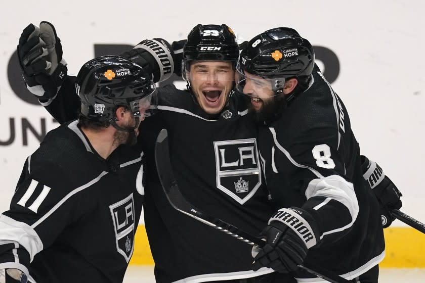 Los Angeles Kings right wing Dustin Brown, center, celebrates his goal agains the Minnesota Wild.