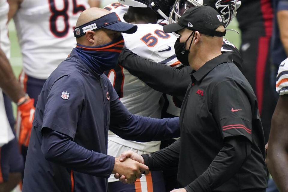 Chicago Bears head coach Matt Nagy speaks with Atlanta Falcons head coach Dan Quinn after an NFL football game, Sunday, Sept. 27, 2020, in Atlanta. (AP Photo/Brynn Anderson)