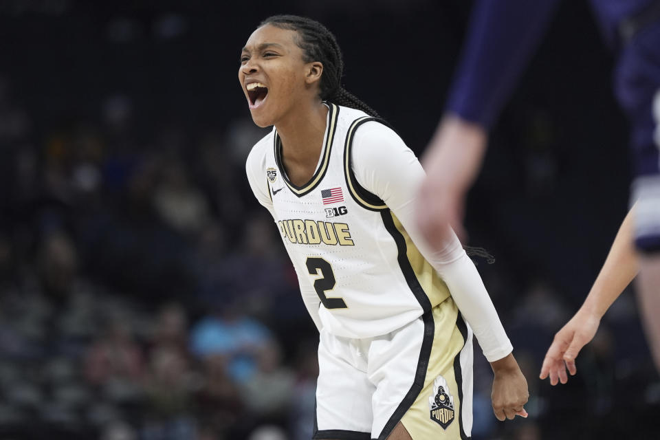 Purdue guard Rashunda Jones (2) celebrates after making a basket while fouled during the second half of an NCAA college basketball game against Northwestern at the Big Ten women's tournament Wednesday, March 6, 2024, in Minneapolis. (AP Photo/Abbie Parr)