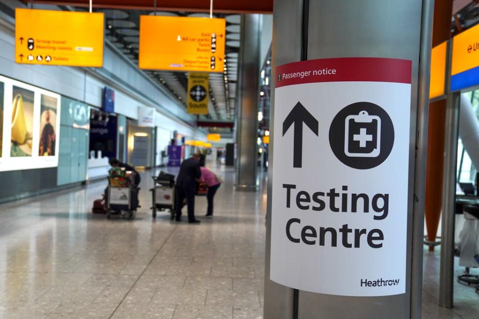 A sign directs passengers to a testing centre at Heathrow Airport (PA) (PA Archive)