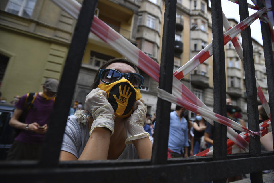 Students of the University of Theatre and Film Arts (SZFE) and their sympathizers form a human chain in protest against changes to the way the university is governed in Budapest, Hungary, Sunday, Sept. 6, 2020. (Marton Monus/MTI via AP)