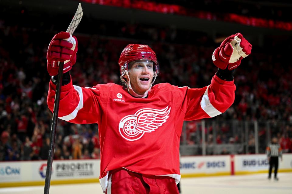 Red Wings right wing Patrick Kane celebrates Dylan Larkin's goal during the second period on Friday, April 5, 2024, at Little Caesars Arena.
