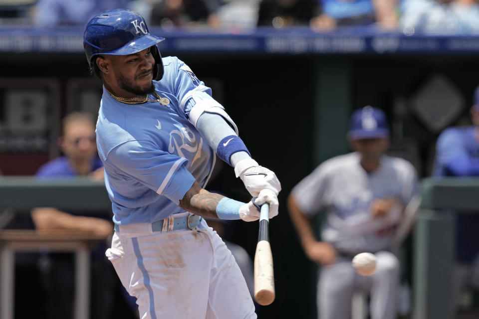 Kansas City Royals' Maikel Garcia hits an RBI single during the second inning of a baseball game against the Los Angeles Dodgers Sunday, July 2, 2023, in Kansas City, Mo. (AP Photo/Charlie Riedel)