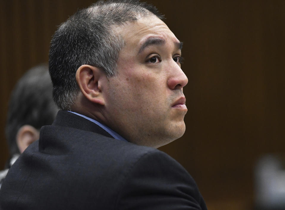 Former Michigan state trooper Mark Bessner listens to Assistant Wayne County Prosecutor Matthew Penney delivers his opening argument in Bessner's trial, Wednesday, April 10, 2019, Detroit. Bessner is charged with second-degree murder in the death of 15-year-old Damon Grimes in 2017. It's the second trial after a jury last fall couldn't reach a unanimous verdict. (Clarence Tabb Jr./Detroit News via AP)