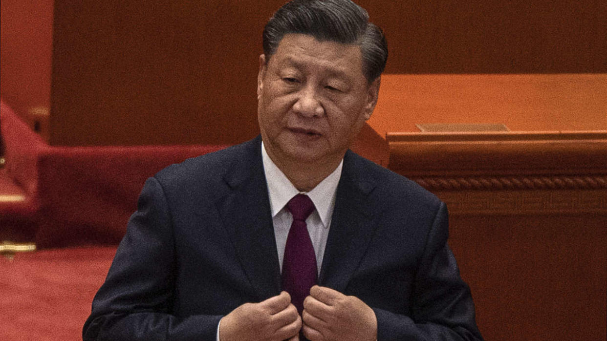 BEIJING, CHINA - APRIL 08: Chinese President Xi Jinping buttons his jacket at a ceremony to honour contributions to the Beijing 2022 Winter Olympics and Paralympics at the Great Hall of the People on April 8, 2022 in Beijing, China. (Photo by Kevin Frayer/Getty Images)