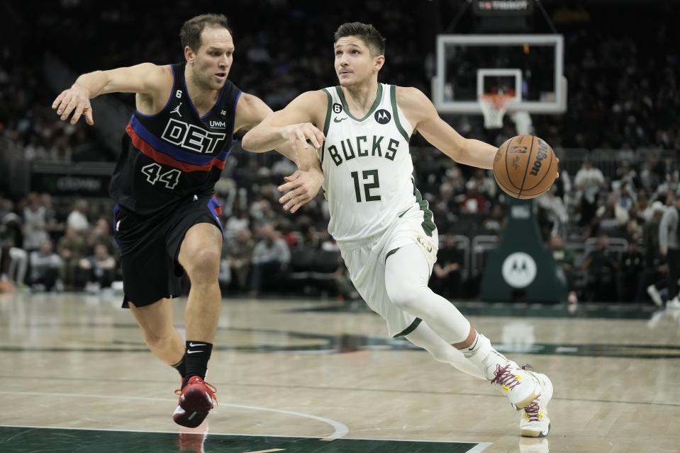 Milwaukee Bucks' Grayson Allen tries to get past Detroit Pistons' Bojan Bogdanovic during the second half of an NBA basketball game Wednesday, Nov. 2, 2022, in Milwaukee. The Bucks won 116-91. (AP Photo/Morry Gash)