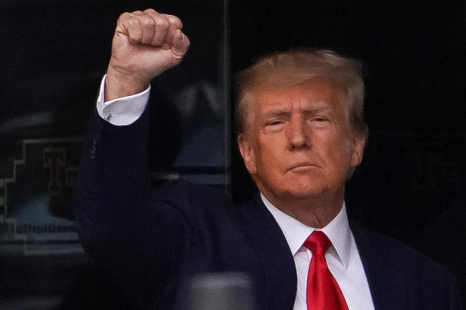 Donald Trump gives a fist bump as he departs from Trump Tower (REUTERS)