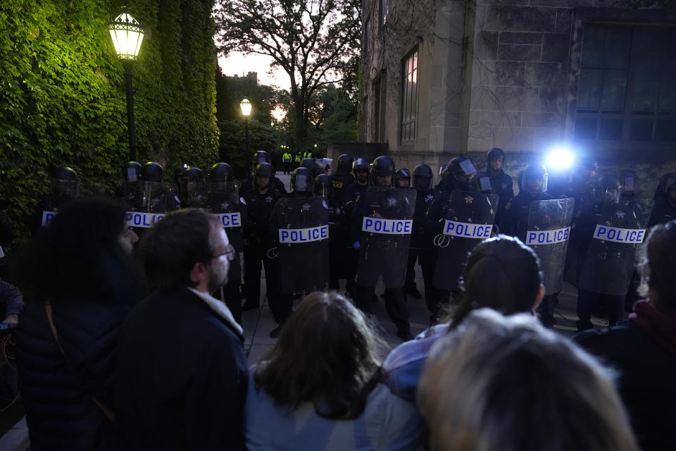 Police block pro-Palestinian protesters from returning to their encampment as the encampment is dismantled at the University of Chicago, Tuesday, May 7, 2024. (AP Photo/Charles Rex Arbogast)