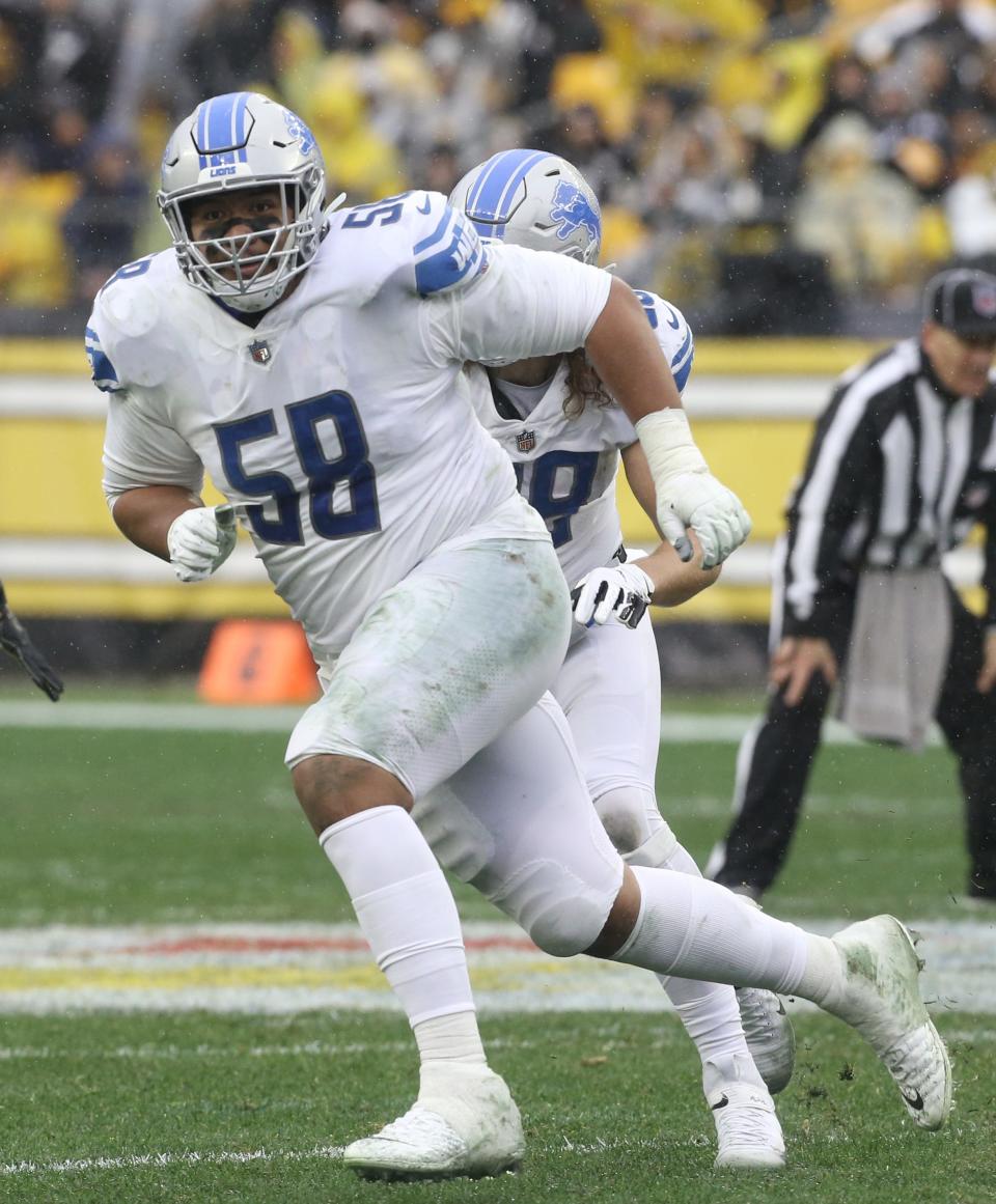 Detroit Lions offensive tackle Penei Sewell run blocks against the Pittsburgh Steelers during the third quarter at Heinz Field, Nov. 14, 2021.