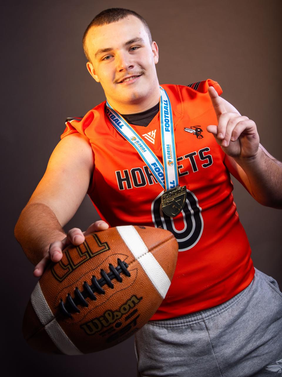 The Gainesville Sun Small School Defensive Player of the Year is linebacker Andrew Zock, of Hawthorne High School. Zock won State with his team this year and Zock was named MaxPreps Small School All-American. He poses with his State Championship medal. [Doug Engle/Ocala Star Banner]2024
