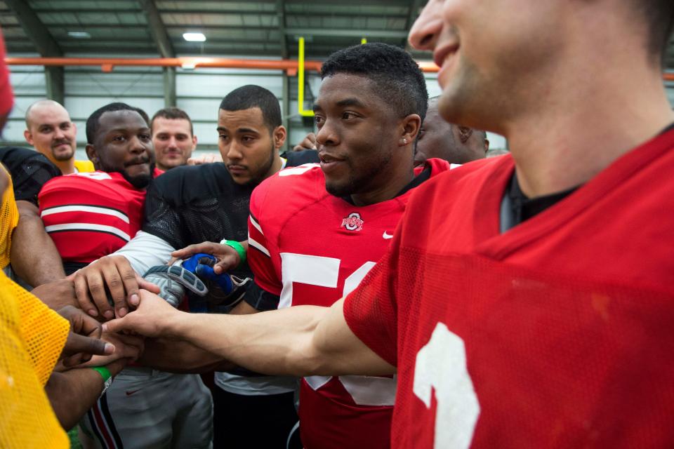 Chadwick Boseman (center) is an Ohio State prospect looking to get picked early in the NFL Draft in "Draft Day."