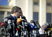 Louay Safi, spokesperson for the Syrian National Coalition, Syria's main political opposition group, gestures as he talks to journalists after a meeting with the Syrian government at the United Nations headquarters in Geneva, Switzerland, Switzerland, Tuesday, Feb 11, 2014. A second round of peace talks between the Syrian government and the opposition bogged down quickly Tuesday in recriminations about who was responsible for escalating violence that has killed hundreds in the past few days and disrupted food aid for trapped civilians. (AP Photo/Anja Niedringhaus)