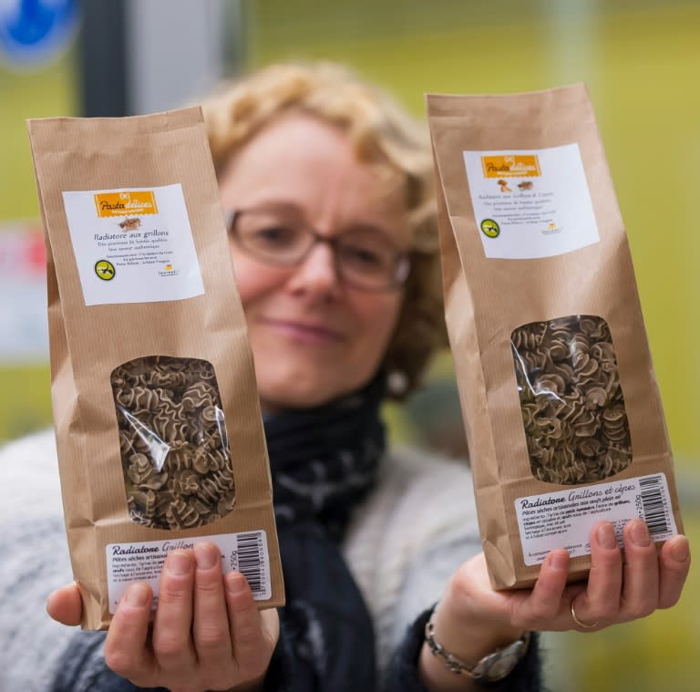 Director of the L'Atelier a pates ('The pasta shop') Stephanie Richard holds pasta packages made with a mix of spelt flour and insects flour, in Thiefosse, eastern France