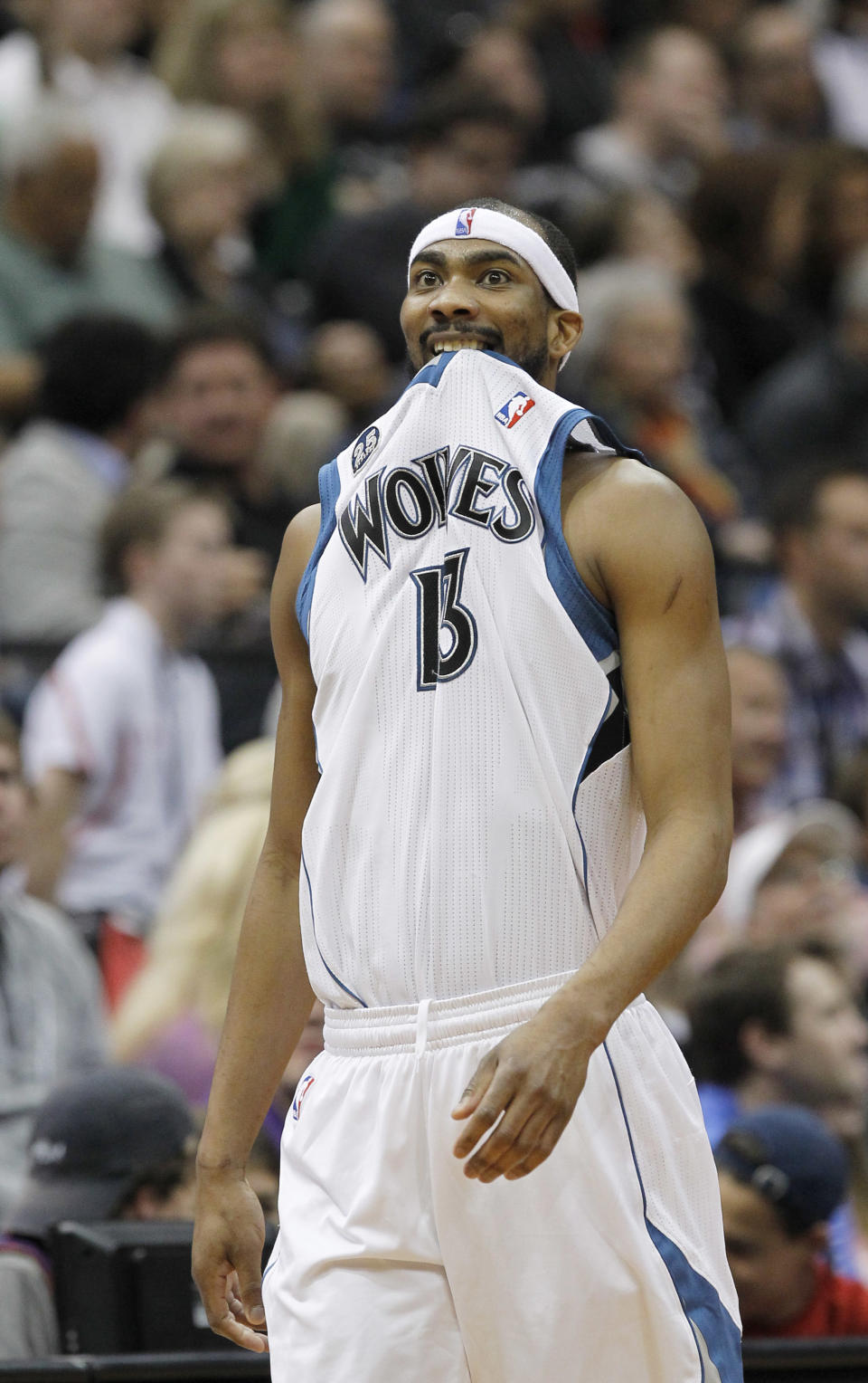 Minnesota Timberwolves forward Corey Brewer walks downcourt as a teammate shoots a free throw during the second quarter of an NBA basketball game against the Houston Rockets in Minneapolis, Friday, April 11, 2014. (AP Photo/Ann Heisenfelt)
