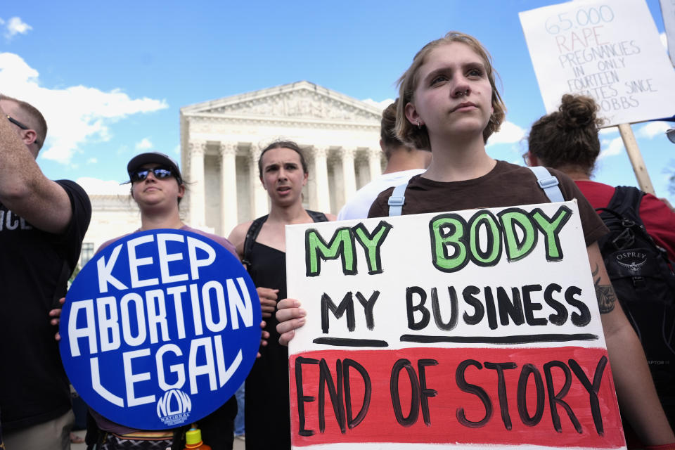 FILE - Abortion rights activists and Women's March leaders protest as part of a national day of strike actions outside the Supreme Court, June 24, 2024, in Washington. A new poll finds that a solid majority of Americans oppose a federal abortion ban and that a rising number support access to abortions for any reason. (AP Photo/Alex Brandon, File)