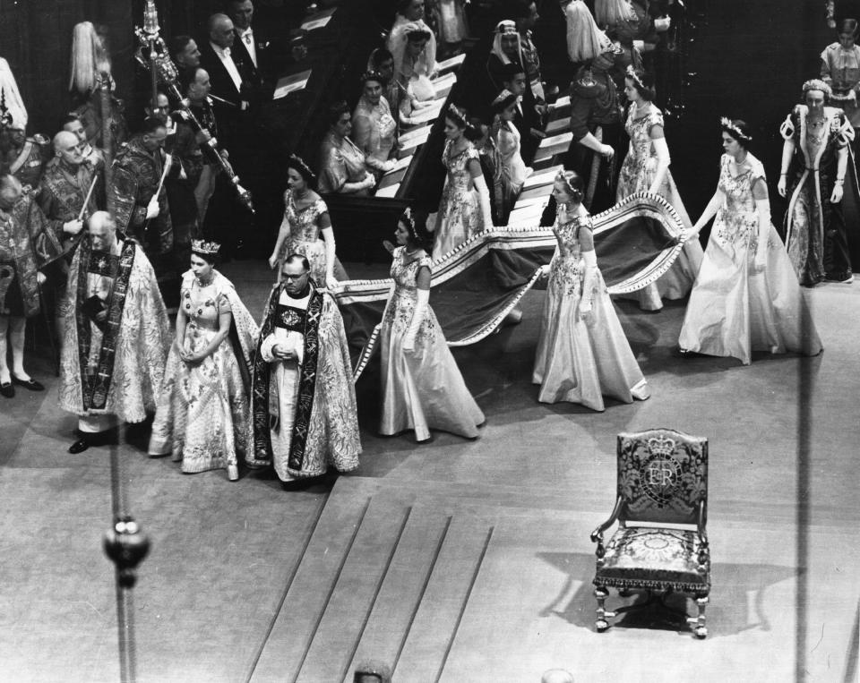 The Queen and her retinue, who are carrying her train, at her coronation.<span class="copyright">Hulton Archive/Getty Images</span>