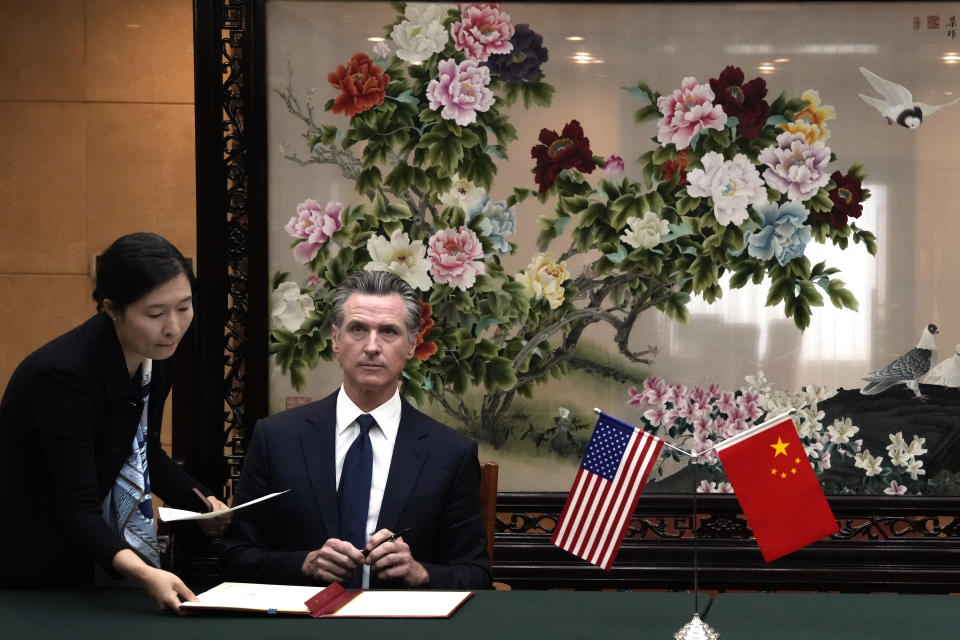 California Gov. Gavin Newsom prepares to sign a Memorandum of Understanding with Zheng Shanjie, head of China's National Development and Reform Commission, not in photo, in Beijing, Wednesday, Oct. 25, 2023. California Gov. Newsom also met with China's senior most diplomat Wang Yi on Wednesday and displayed a brief moment of friendliness that stands in sharp contrast to the dialogue between the U.S. and China in recent years. (AP Photo/Ng Han Guan)
