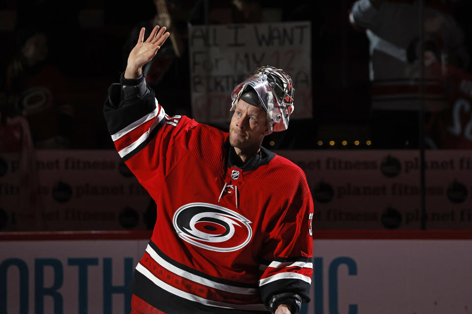 Carolina Hurricanes goaltender Antti Raanta (32) salutes the crowd as the second start of the game following the Hurricanes overtime win of the Buffalo Sabres at an NHL hockey game in Raleigh, N.C., Tuesday, Nov. 7, 2023. (AP Photo/Karl B DeBlaker)