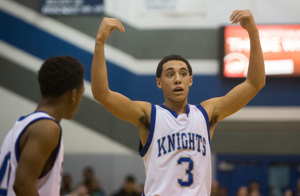 Marian's Devin Cannady (3) calls for teammates to come together January 16, 2015, during the St. Joseph-Marian boy's basketball game at Marian High School. Cannady will be in Mishawaka Saturday at the dedication of Cannady Court in Heroes Park. Tribune File Photo/GREG SWIERCZ