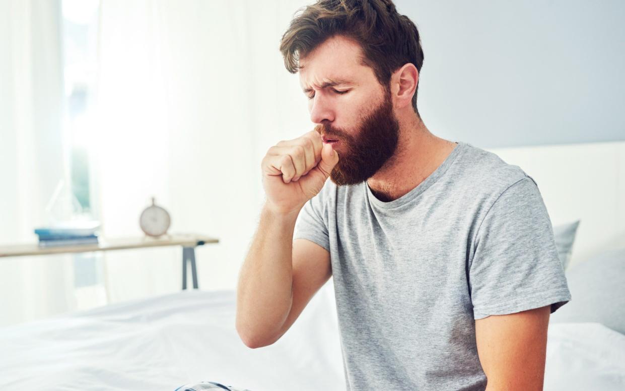 A man coughing - Moyo Studio/ Getty