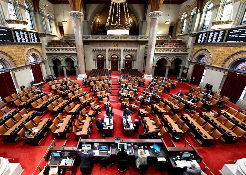 Members of the New York Assembly debate in the Assembly Chamber at the New York State Capitol in Albany, N.Y.