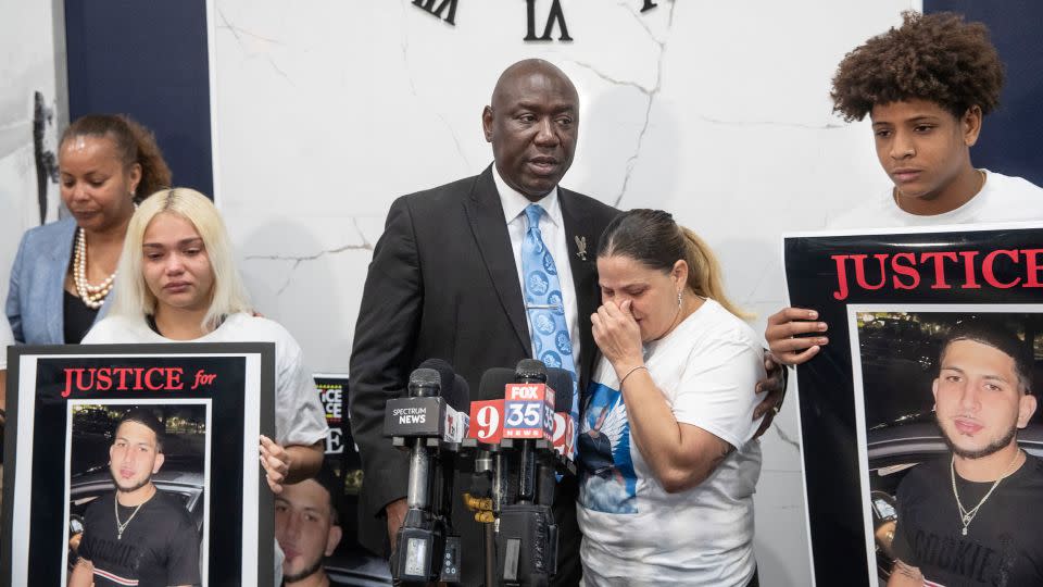 Attorney Ben Crump holds Yaneri Diaz Rodriguez as she cries during a news conference about the killing of her son, Derek Diaz. - Willie J. Allen Jr./Orlando Sentinel/Tribune News Service/Getty Images