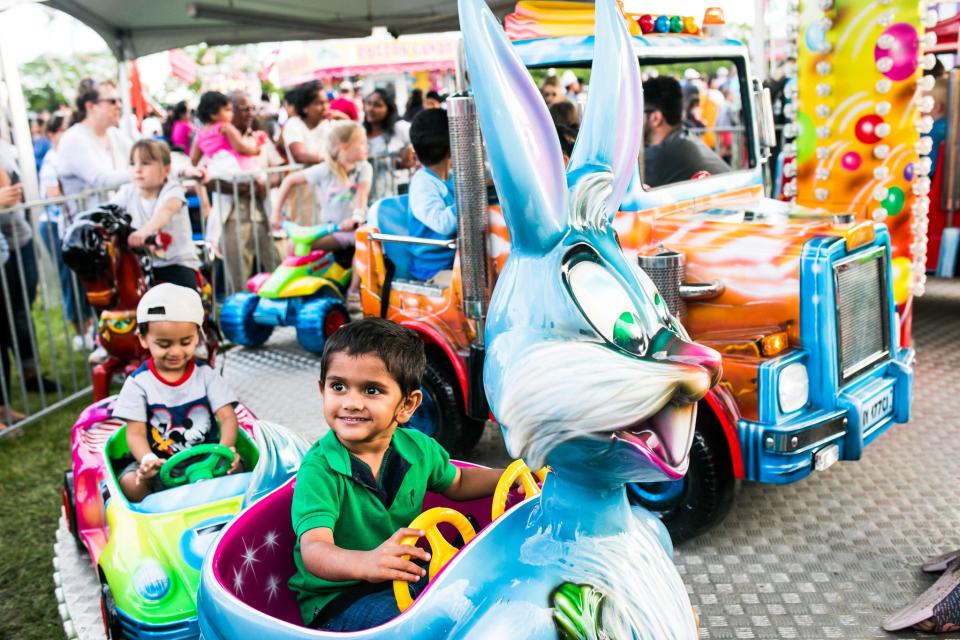 Children on carnival rides at Canton's Liberty Fest.