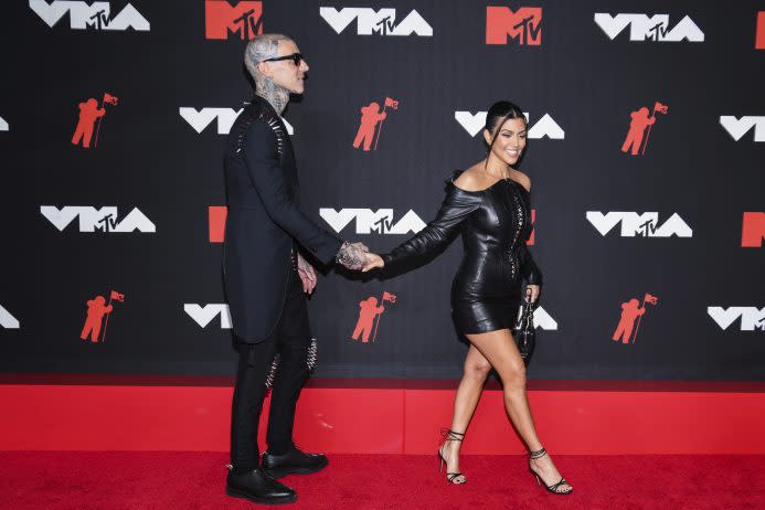 Travis Barker, Kourtney Kardashian - Credit: Sipa USA via AP