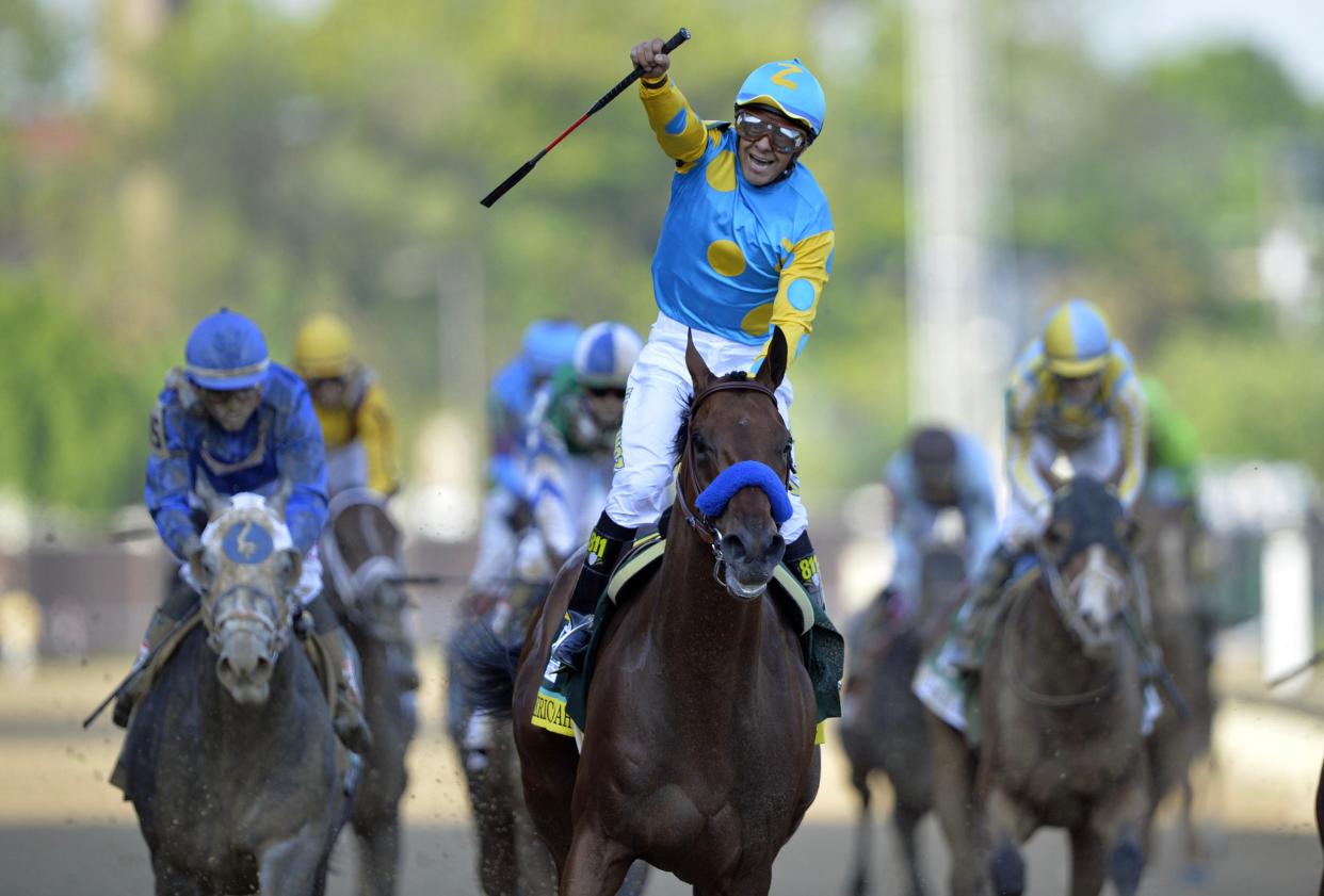 Victor Espinoza aboard American Pharoah celebrates winning the 141st Kentucky Derby at Churchill Downs on May 2, 2015.