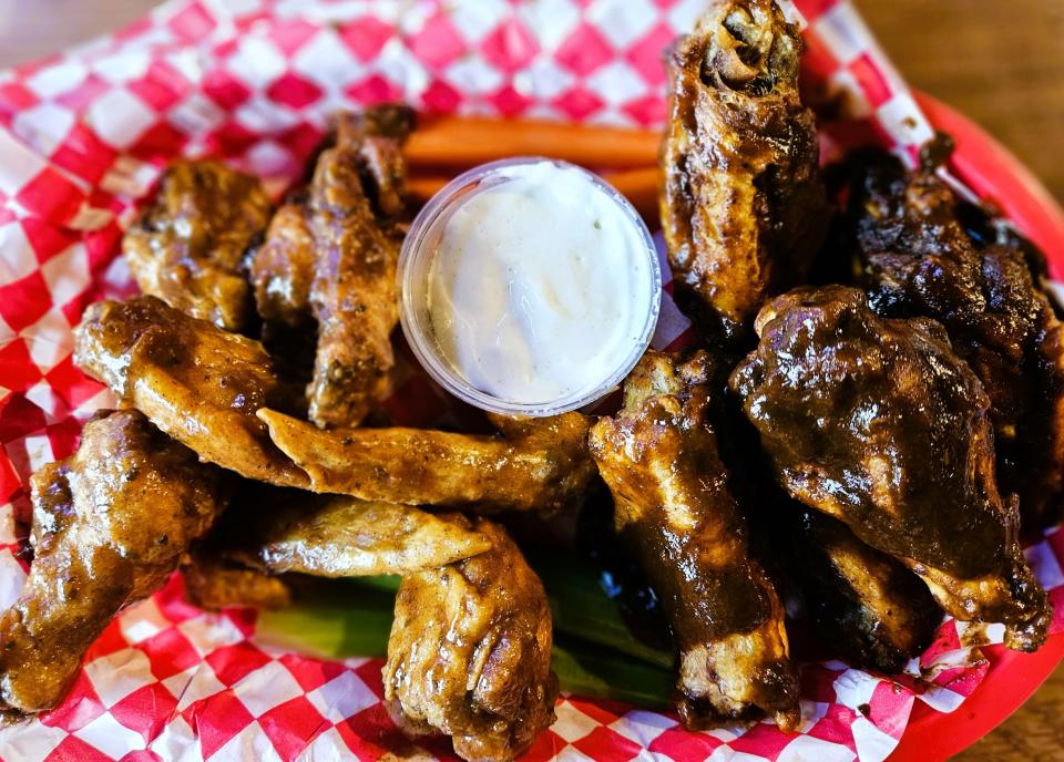 Cajun Heat, right, and Jamaican Jerk wings at Jaxx Sports Bar & Grill in Palmetto photographed Sept. 6, 2023.