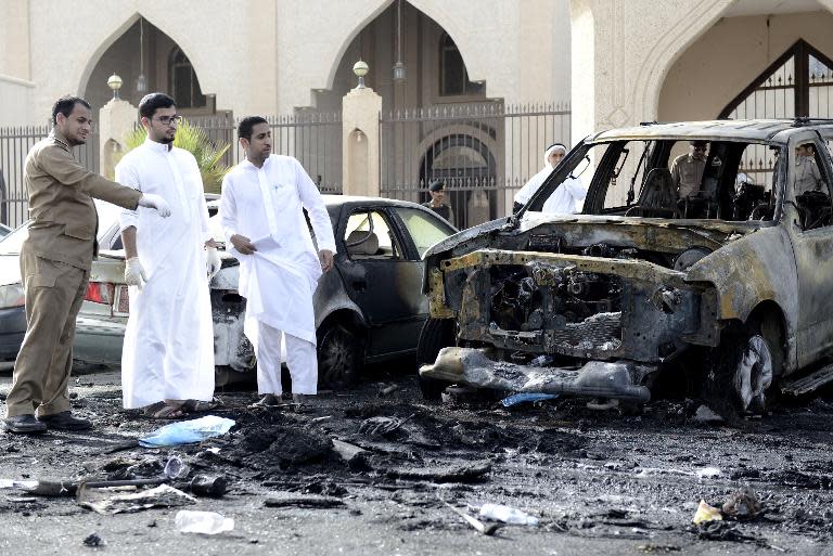 Saudi security forces and forensic personnel inspect the site of a suicide bombing that targeted the Shiite Al-Anoud mosque in the coastal city of Dammam on May 29, 2015