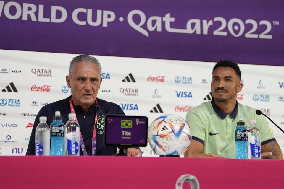 Brazil's head coach Tite, left, and player Danilo attend a press conference on the eve of the World Cup quarter final soccer match between Brazil and Croatia in Doha, Qatar, Thursday, Dec. 8, 2022. (AP Photo/Andre Penner)